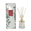 Aromat diffuser with floral packaging on a white background