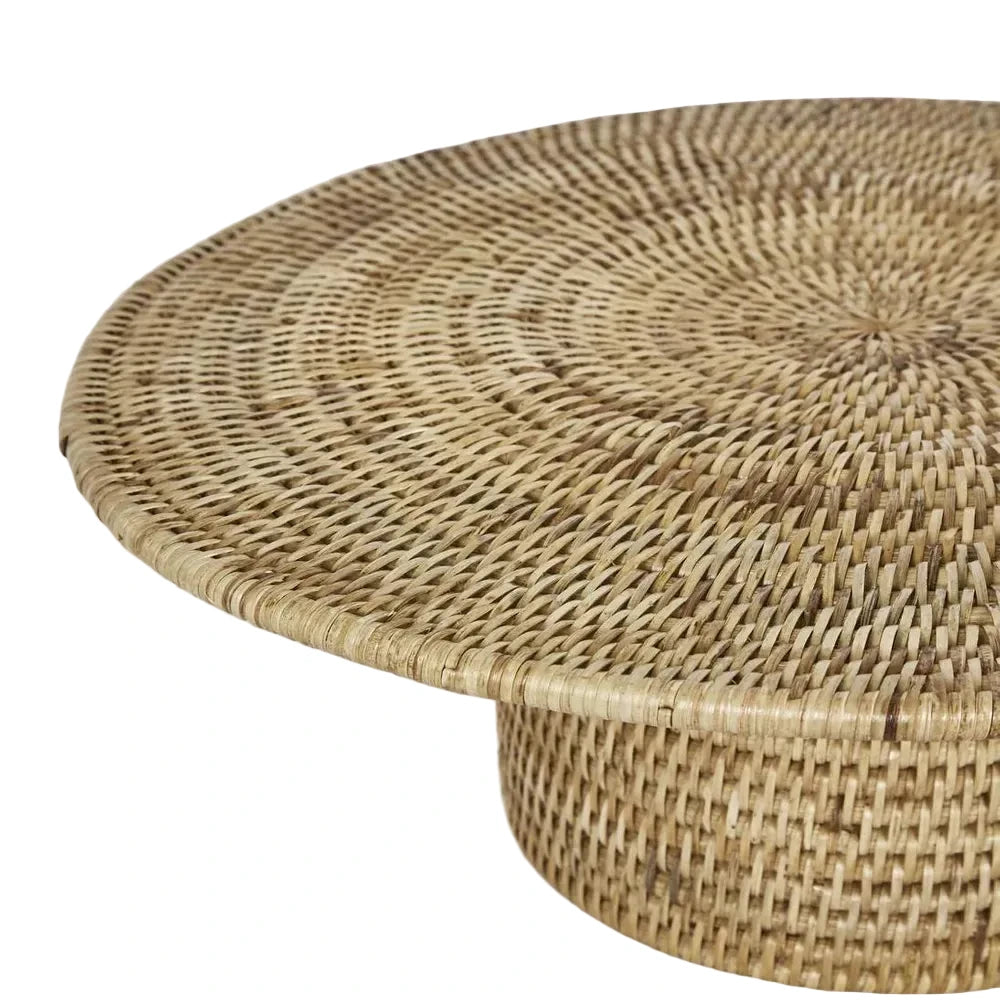 Woven rattan coffee table on a light gray background