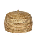Woven rattan lid on a light gray background