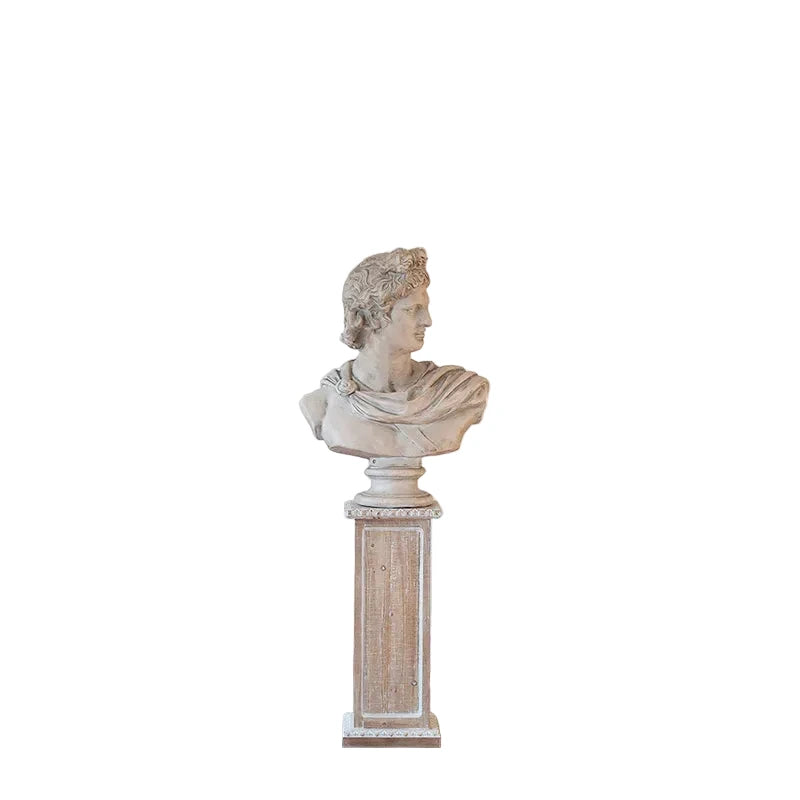 Statue on a pedestal in a room with decorative elements