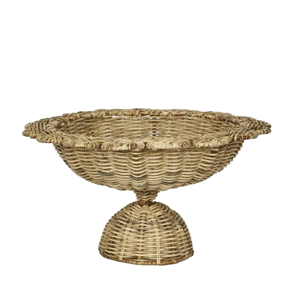 Wicker basket with a pedestal base on a light gray background