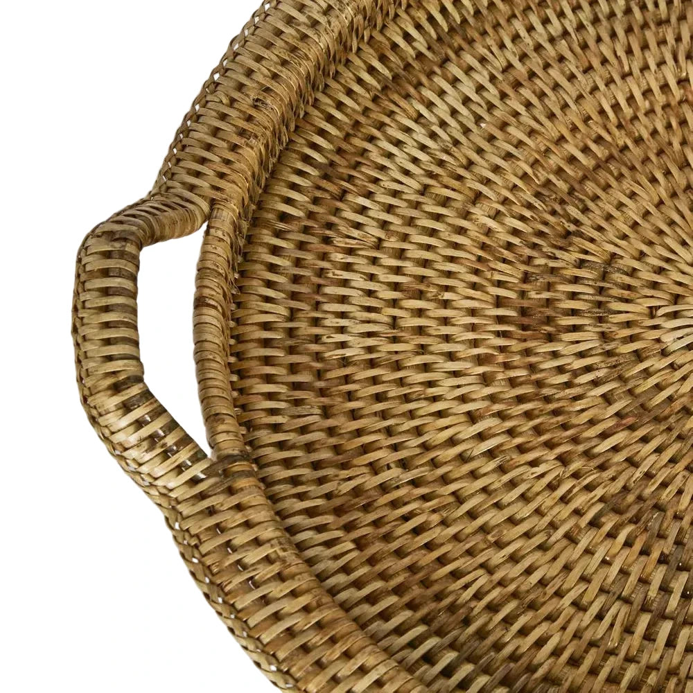 Close-up of a wicker basket with a handle on a light gray background