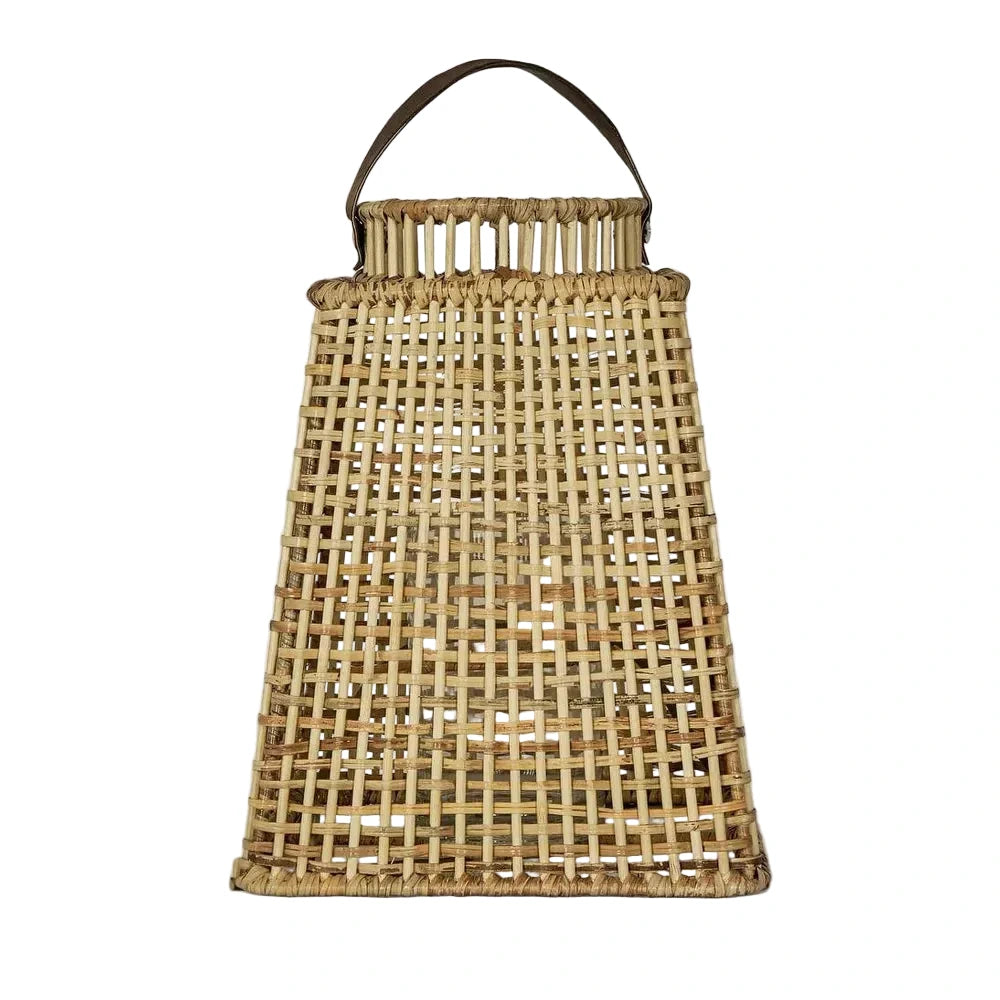 Woven basket with a handle on a light gray background