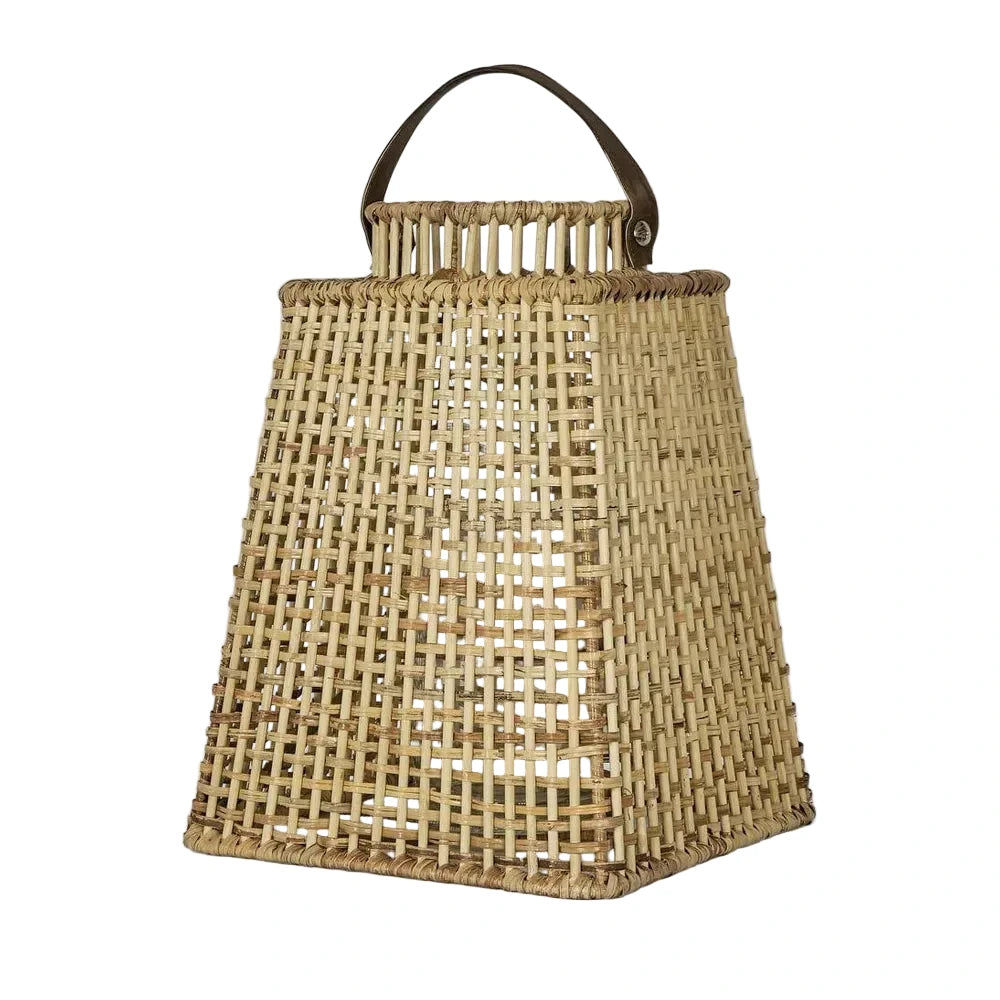 Woven basket with a handle on a light gray background