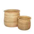 Two woven baskets on a light gray background