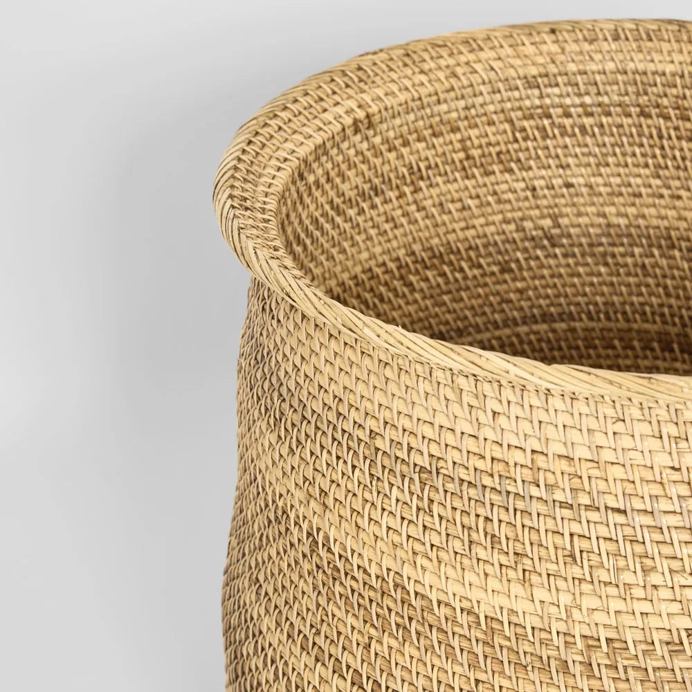 Close-up of a woven basket with a plain background