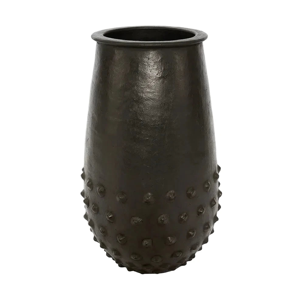 Black textured vase on a light gray background