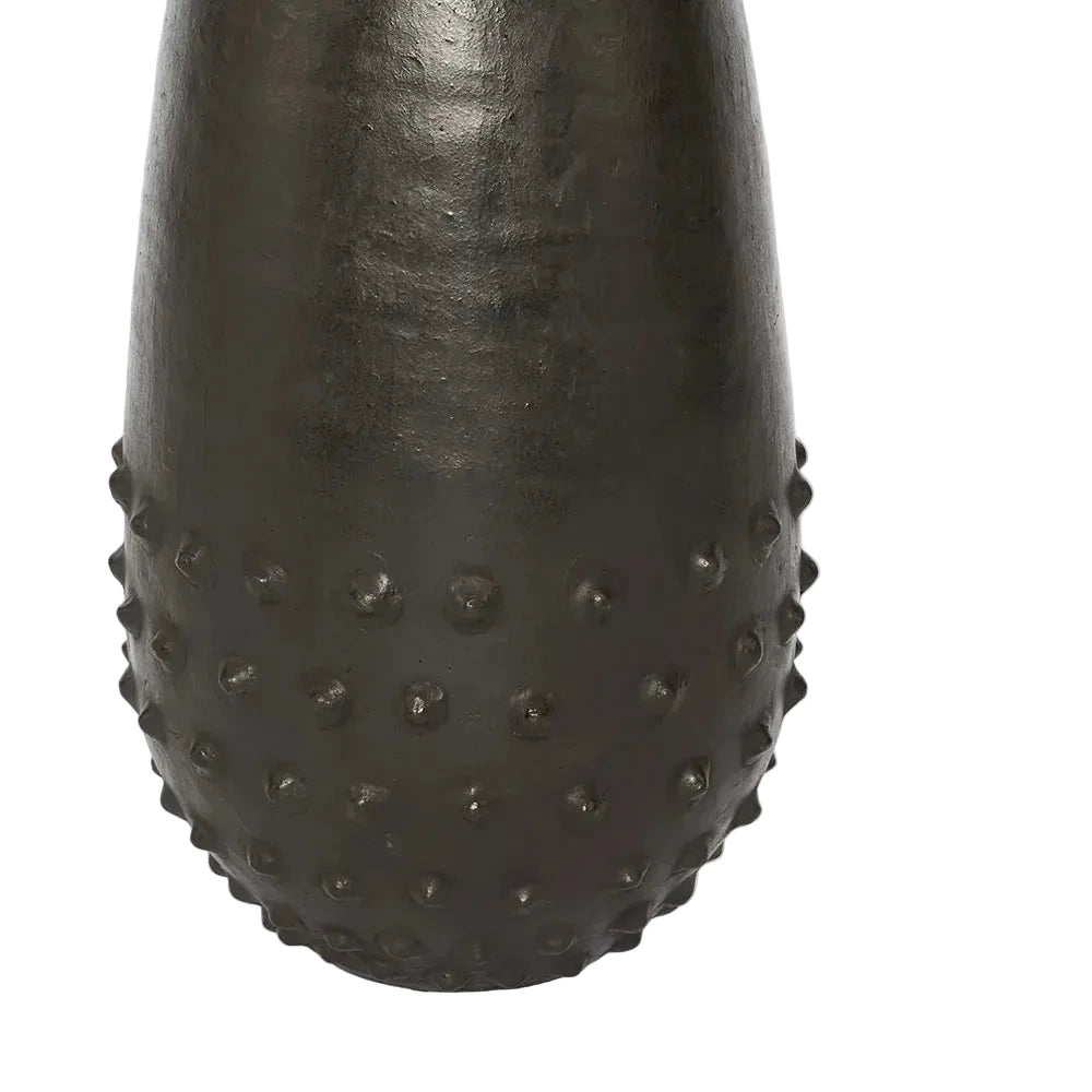 Black textured vase on a white background