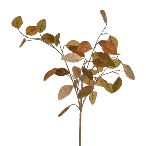 Artificial plant branch with autumn leaves on a light gray background