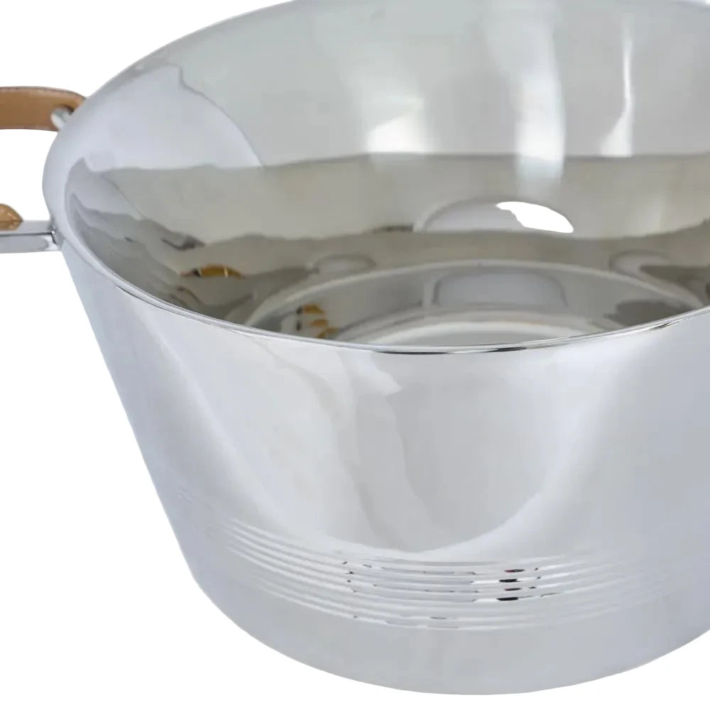 Close-up of a metallic bowl with wooden handles on a white background