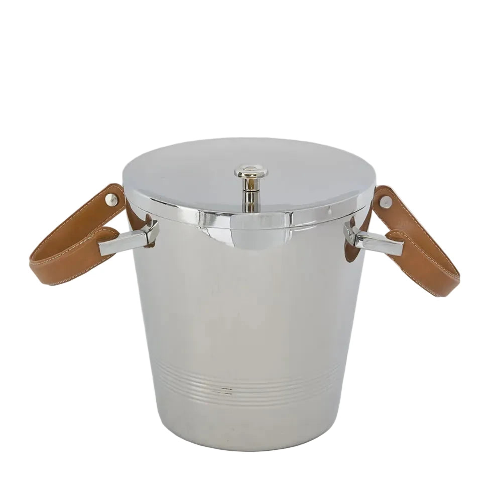 Metallic ice bucket with leather handles on a light gray background