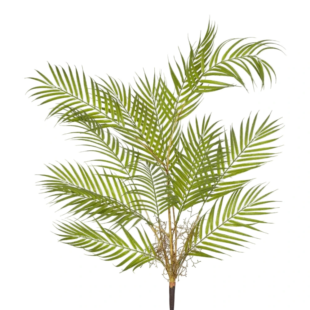 Artificial palm plant on a light gray background
