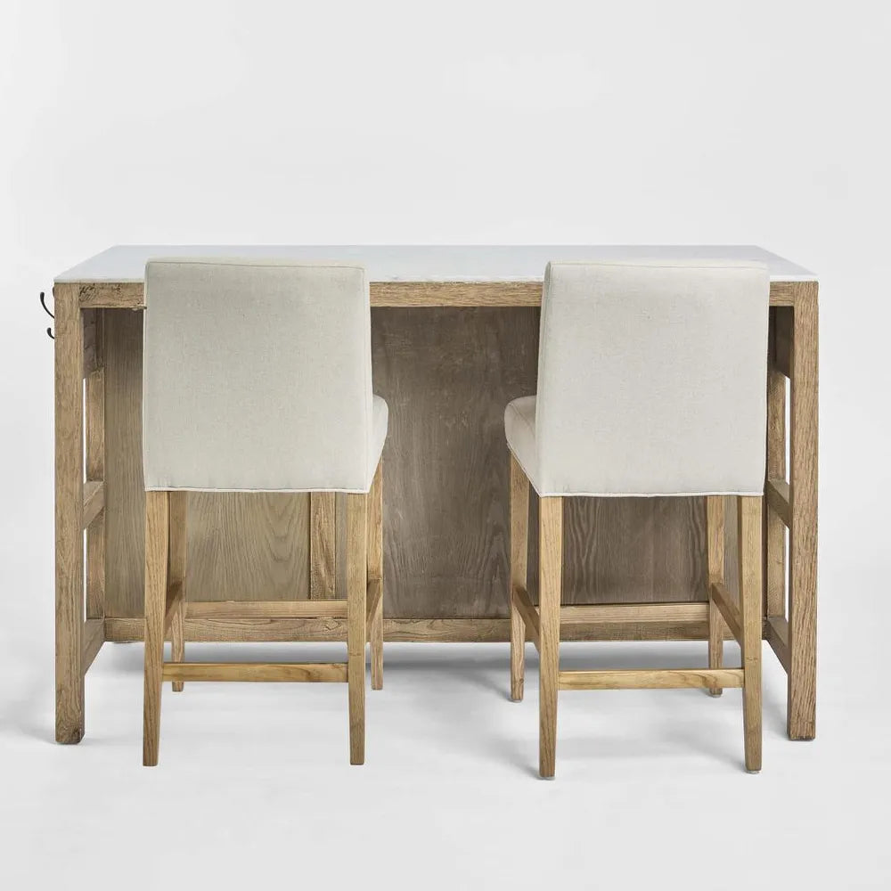 Two wooden bar stools with white cushioned seats on a light gray background