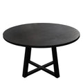 Round black table with a minimalist design on a white background