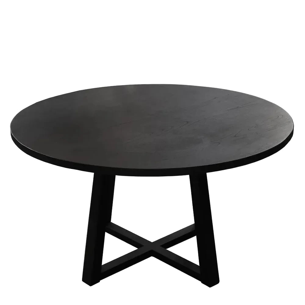 Round black table with a minimalist design on a white background
