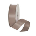 Brown satin ribbon spool on a light gray background