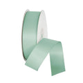 Spool of light green ribbon on a white background