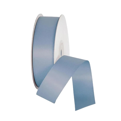 Roll of blue ribbon on a white background