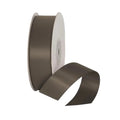 Maroon ribbon spool on a light gray background