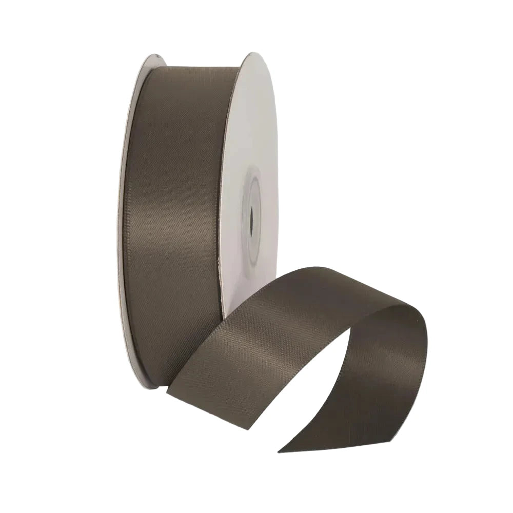 Maroon ribbon spool on a light gray background