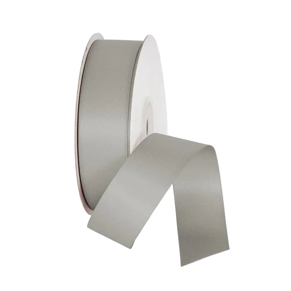 Roll of gray ribbon on a white background