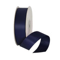 Maroon ribbon spool on a light gray background