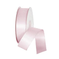Pink satin ribbon on a light gray background