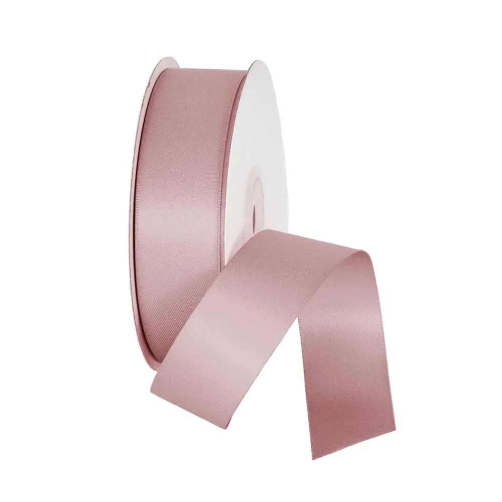 Pink satin ribbon on a white background