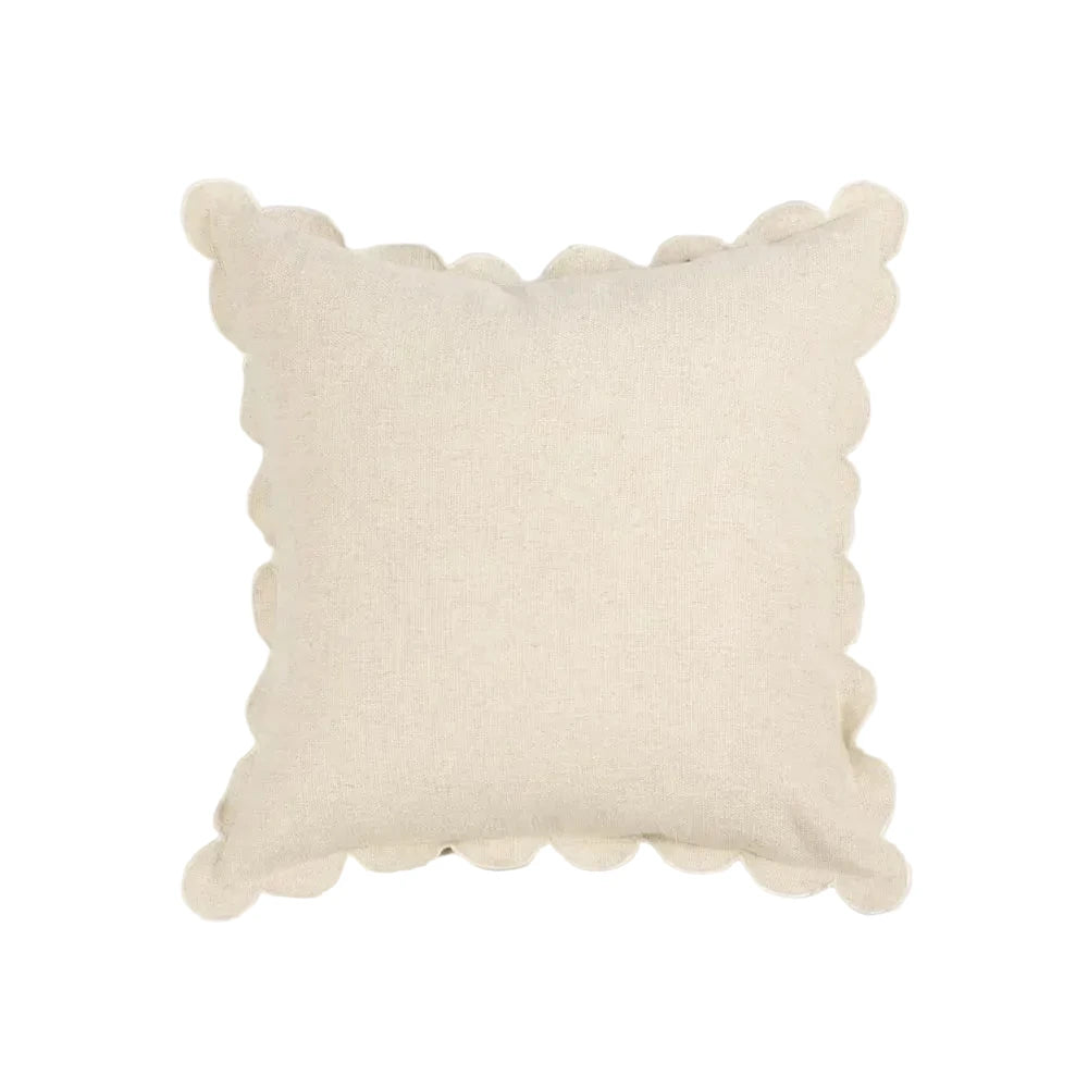 Beige pillow with textured edges on a light gray background