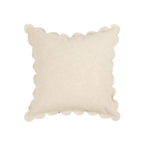 Beige pillow with textured edges on a light gray background