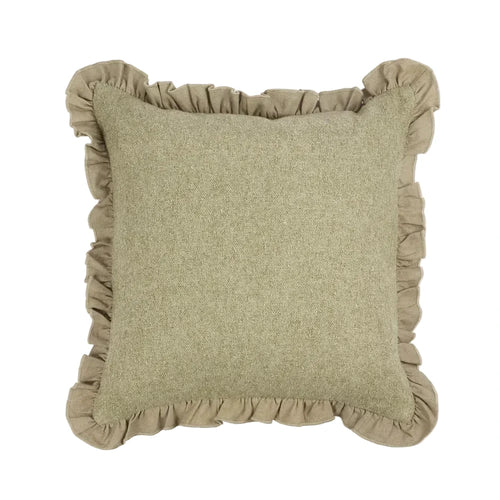 Green cushion with ruffled edges on a white background