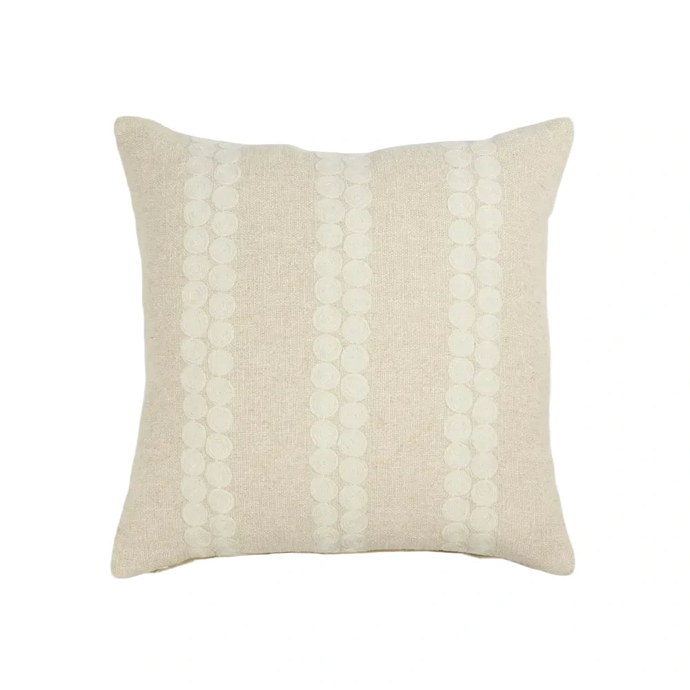 Beige pillow with a textured pattern on a white background