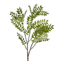 Artificial green leaf branch on a light gray background