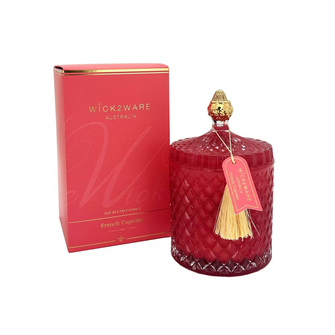 Red candle with decorative elements and a matching box on a white background