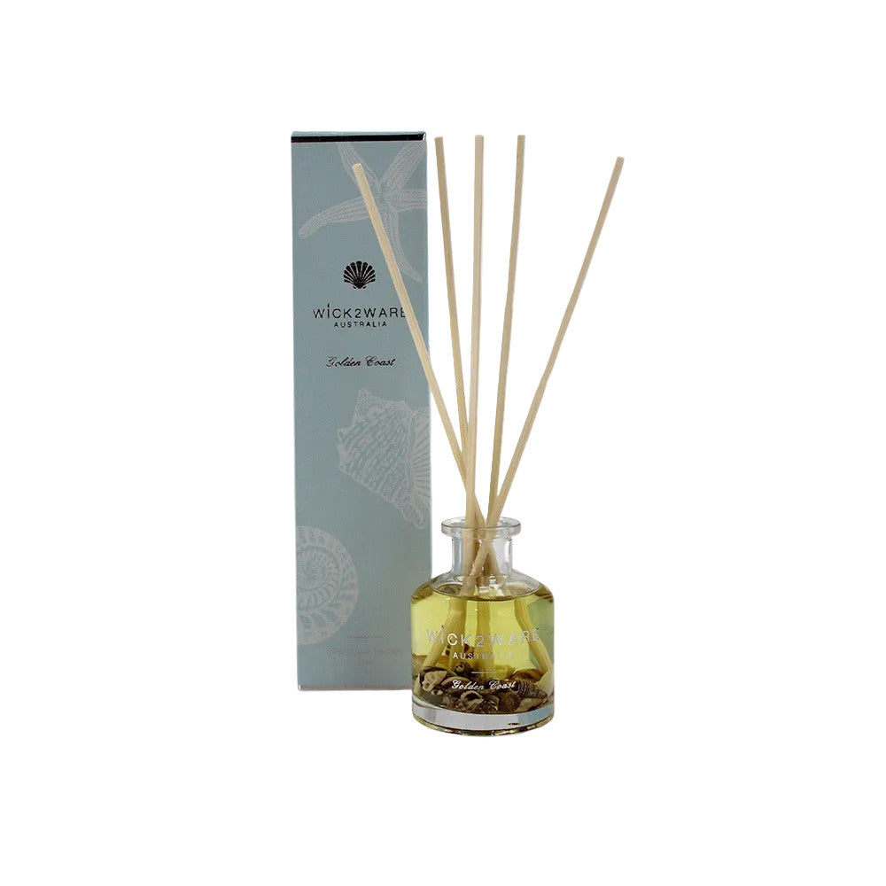 Diffuser bottle with wooden sticks and packaging on a white background