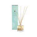Reed diffuser set with bottle and sticks next to packaging on a white background