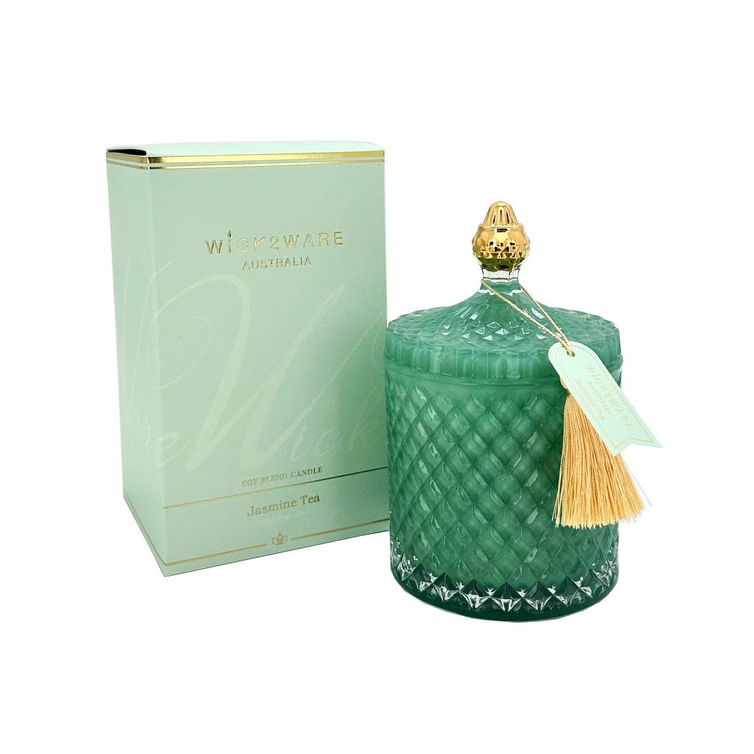 Decorative candle with a textured green design and gold accents, next to its packaging box on a white background.