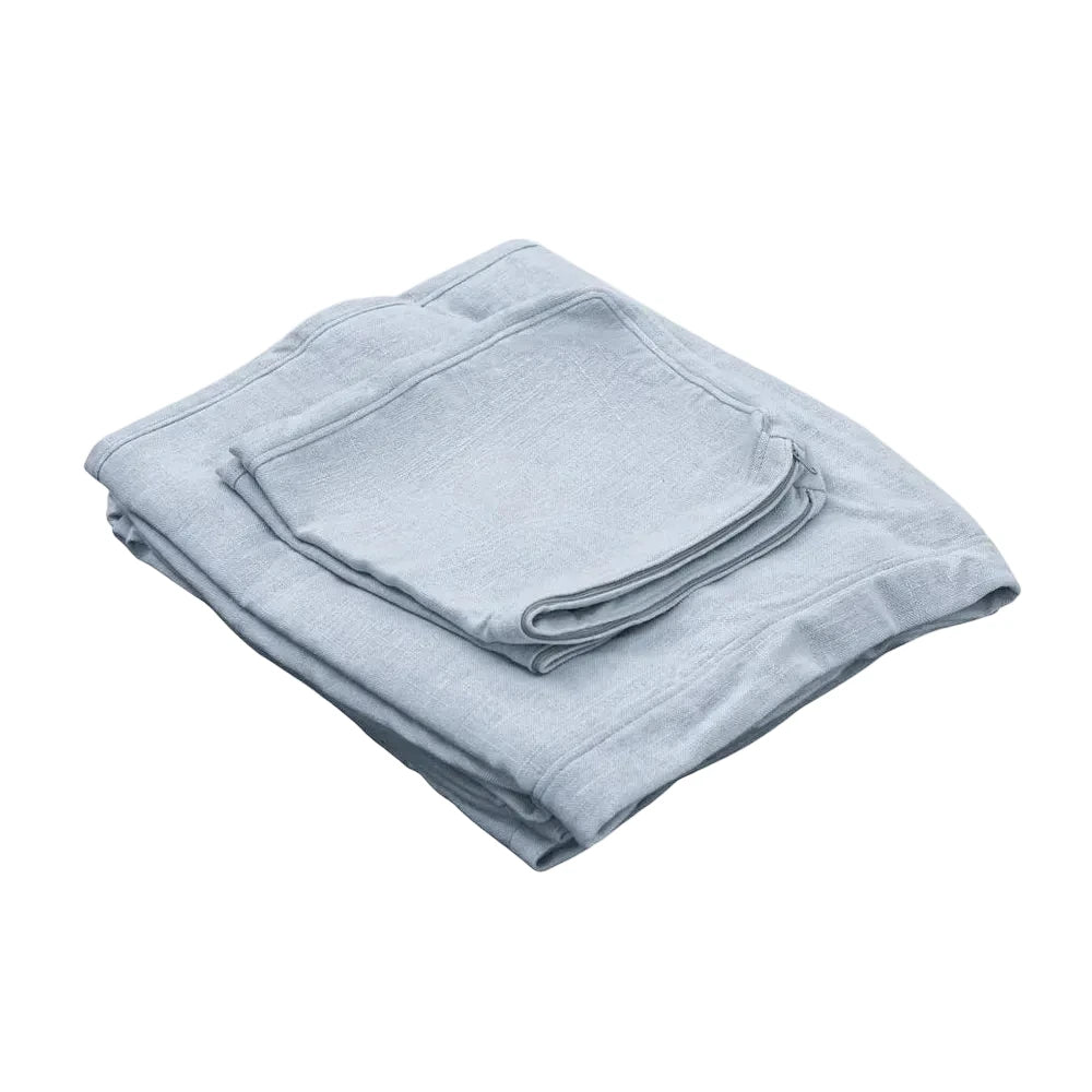 Folded light blue towel on a white background