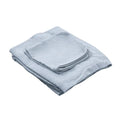 Folded light blue towel on a white background