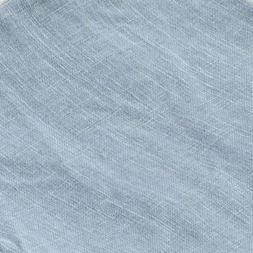 Close-up of textured blue fabric with a subtle pattern