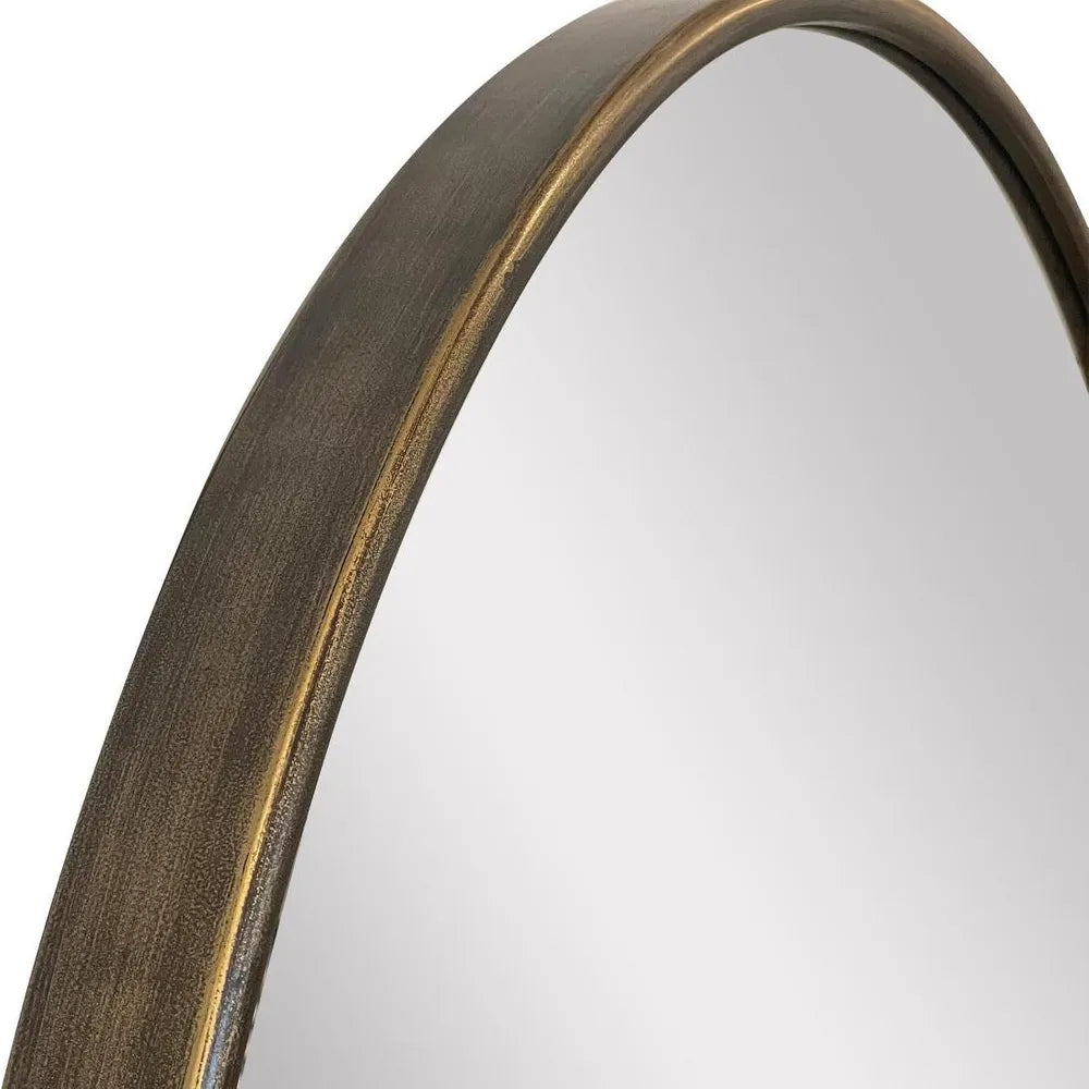 Round mirror with a bronze frame on a white background