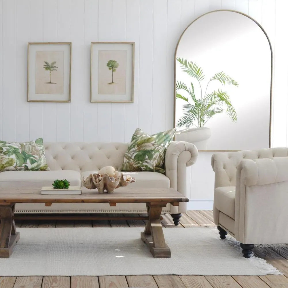 Living room with beige sofa, armchair, and wooden coffee table.