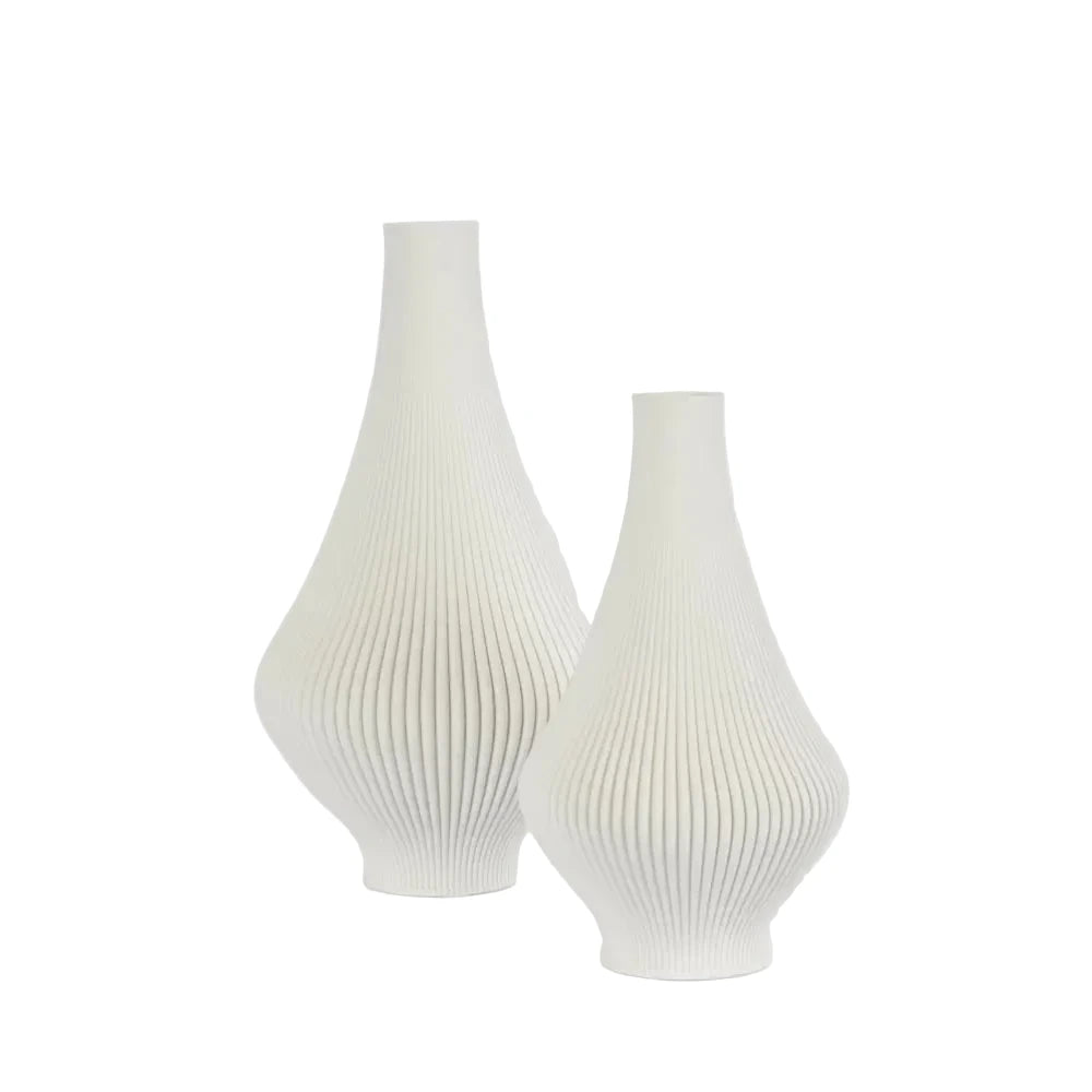 Two white textured vases on a light gray background