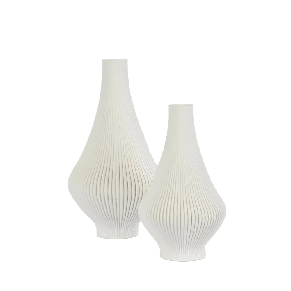 Two white textured vases on a light gray background