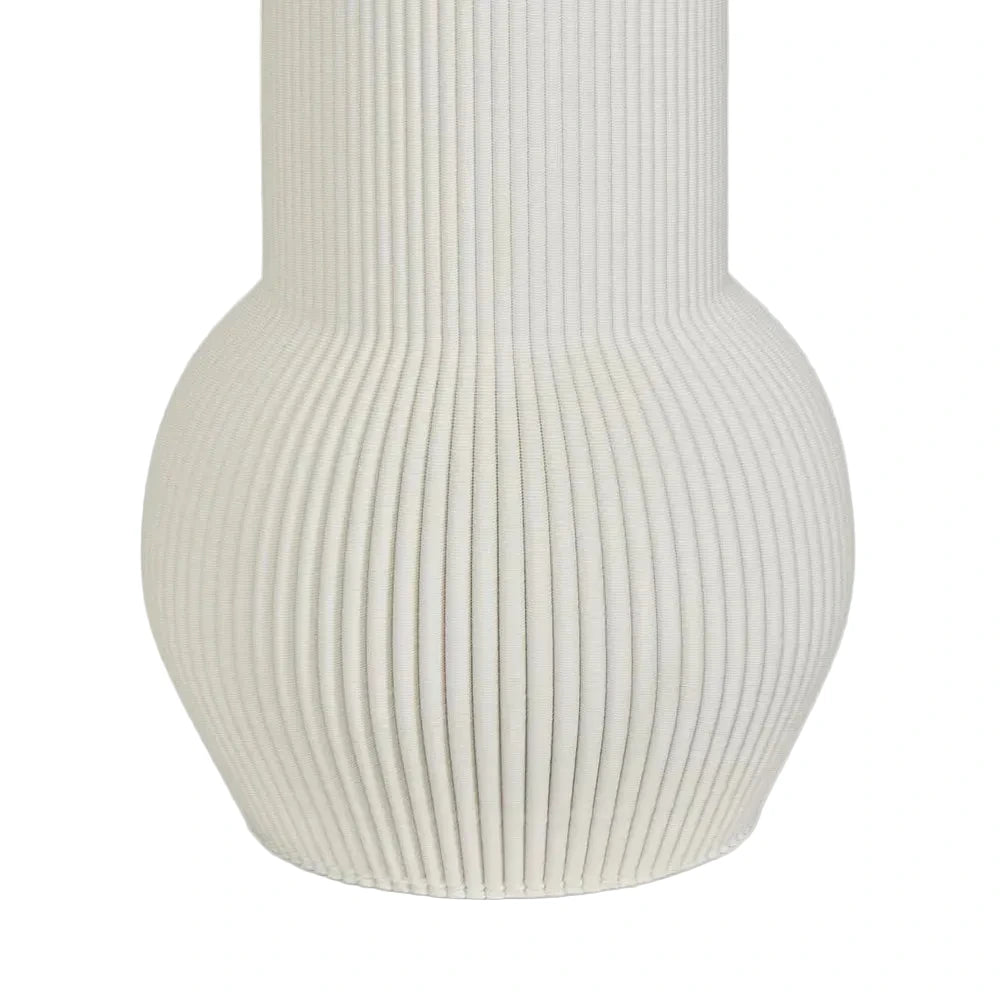 White ribbed vase on a light gray background