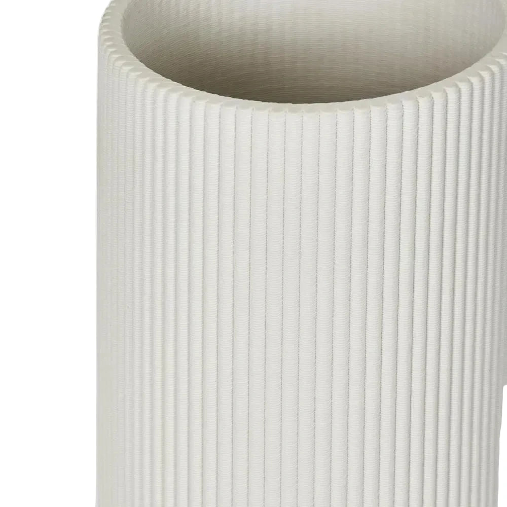 Textured white vase on a light gray background