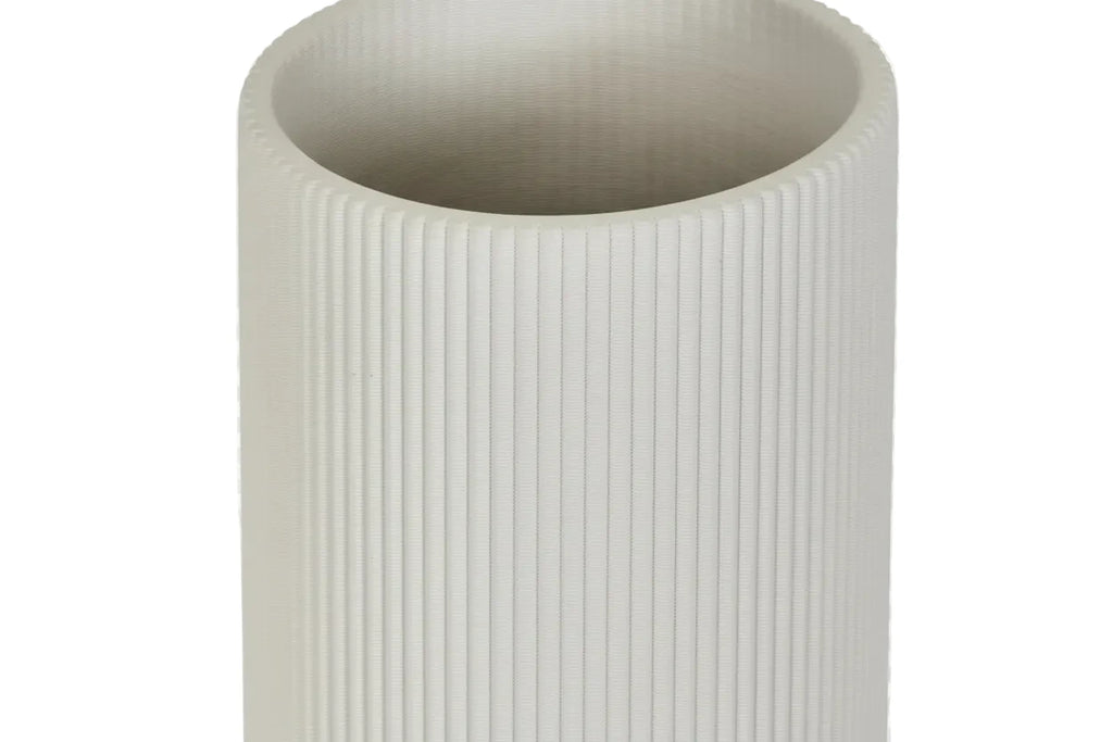 Close-up of a textured cylindrical object on a white background