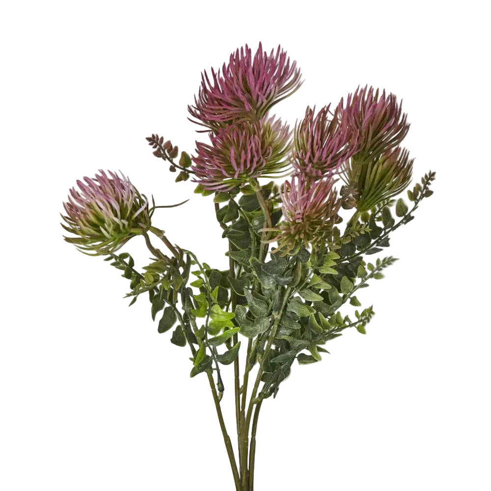 Artificial flower arrangement with pink and green leaves on a light gray background